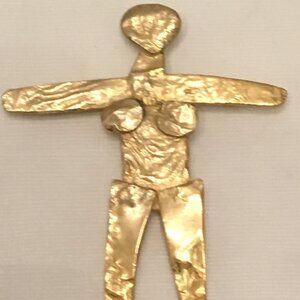 Female figure pendant. Gold plated created by Joanne Cooper in 1980s